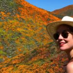 Kenneth Mitchell Instagram - Marinating in the wonderment of the Poppy Super Blooms with my #StarTrek buddy @couttsemily #LLAP #StarTrekDiscovery 🧡 Walker Canyon Poppy Fields