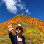 Kenneth Mitchell Instagram - Marinating in the wonderment of the Poppy Super Blooms with my #StarTrek buddy @couttsemily #LLAP #StarTrekDiscovery 🧡 Walker Canyon Poppy Fields