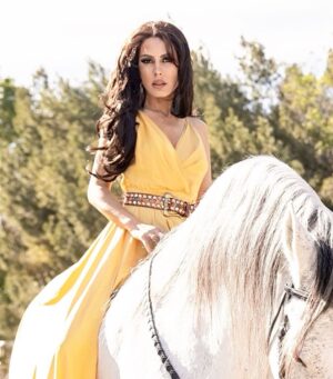 Kerri Kasem Instagram - "True greatness depends on total wisdom. The real lesson is to learn to love."
-LRH

I hope you have an abundance of love in your life and if you feel like you’re lacking… here’s a great big virtual hug! 

Another great shot for @fashionmagazinenyc by @arezoojalali_photography! 💛

Thank you to the team!
@jbeauty_xoxo - make-up
@sky_is_dlimit - stylist
@pr_solo - stylehouse 

@friesiansm - Jardim MT Lusitano horse
@carlossantosdressage - trainer Jardim MT

#Lusitano #YellowDress #NewYorkFashion #GirlsAndHorses