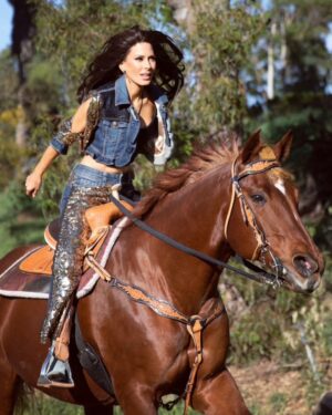 Kerri Kasem Instagram - “Horses lend us the wings we lack.” 
– Unknown

My first horse, Copper Shadow, was a quarter horse that looked just like Bea, the horse in the picture. ❤️🐴

Thank you to the brilliant
@arezoojalali_photography! 

Thank you to the team!
@jbeauty_xoxo - make-up
@sky_is_dlimit - stylist
@declare_denim 
@wear_the future 
@tessasilagy - horse 🐎

@friesiansm - 
Horse coordinator

#Cowgirl #DenimAndDiamonds #Quarterhorse #Western