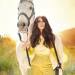 Kerri Kasem Instagram - A Bright Sunshiny Day! 🌞🎶 Photograph by the brilliant @arezoojalali_photography. Thank you Shari @friesiansm for loaning us your beautiful Lusitano, Jardim MT. And thank you Pablo for the beautiful digital background. @jbeauty_xoxo - Make-Up