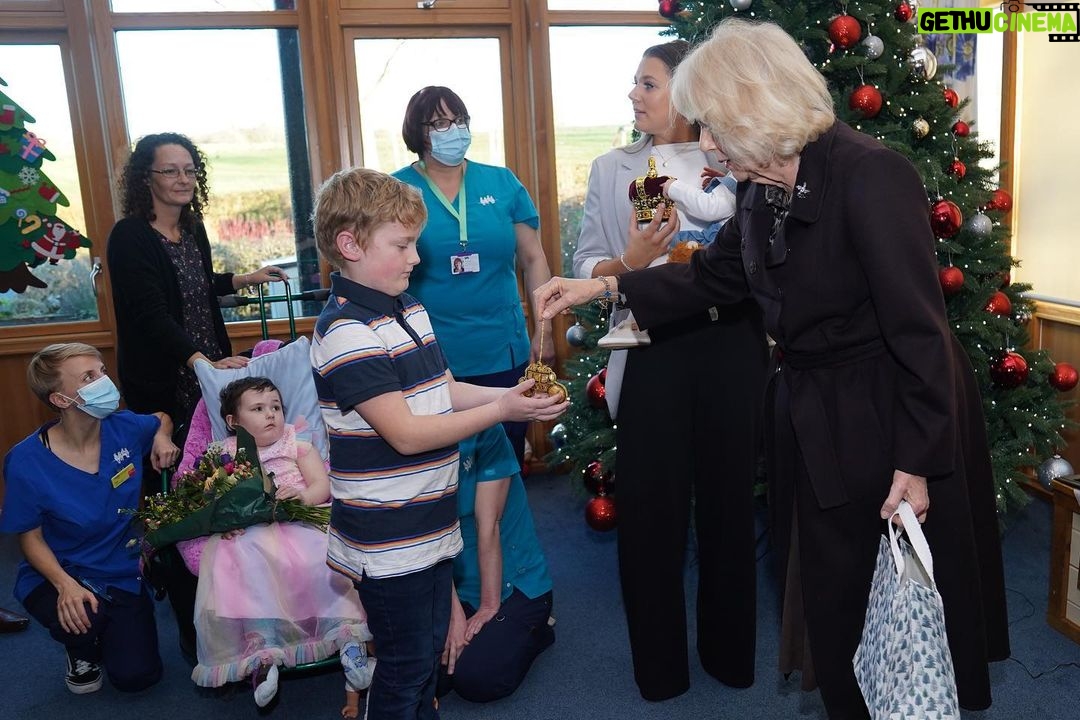 King Charles III of the United Kingdom Instagram - The Queen has spent the day in Bristol and North Somerset, beginning with a visit to celebrate 25 years of Emmaus Bristol. The charity supports individuals who have experienced homelessness, poverty and social exclusion. Those living at @EmmausBristol work in the charity’s social enterprises and receive tailored support plans, training and development opportunities. ⚒️🪑 During the visit, Her Majesty heard about the charity’s income generating streams and spent time with staff and companions, touring the warehouses where donated items are stored, repurposed, or upcycled. Later, Her Majesty visited @childrenshospicesw Charlton Farm site, which provides a homely space for children and young people with life limiting or life-threatening conditions, and their families. Touring the hospice, The Queen met staff and supporters, before joining children to decorate their Christmas tree. 🎄