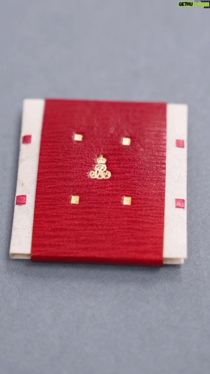 King Charles III of the United Kingdom Instagram - Take a closer look at the process behind creating The Queen’s special contribution - a handwritten introduction - to the new modern-day miniature library to celebrate Queen Mary’s Dolls’ House Centenary year. The book has been bound by the Royal Bindery and features a tiny version of Her Majesty’s cypher in gold… at just 7 millimetres tall! #RoyalCollectionTrust #QMDH100