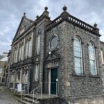 Kiri Pritchard-McLean Instagram - ⚠️ WARNING! SENTIMENTAL POST INCOMING ⚠️ This is where the magic happens. Behind this door and in this beautiful old building. We've been running comedy classes in Canaolfan Glanhwfa with @gwneudmakedo for a few weeks and I just have to tell you about it. After every session @misskatiegill and I have a fizzy, breathless debrief because the talent we have behind that door in the back room of a Chapel turned community centre is unreal. The kids we have coming on Saturdays have soared through our expectations and come to the sessions with big hearts, amazing brains and boundless enthusiasm. I spend every Saturday morning howling with laughter. They're such a clever, offbeat bunch and it warms my heart because they remind me of the funny group of pals I had growing up. Tuesday nights are a special affair too. Our senior class is such a sacred place for me. It's so hard to start learning something as an adult. For so many people comedy means public speaking or it's their true love so the stakes are even higher. I said last night that I did a comedy course as an arrogant 22 year old with lots of free time, I did it the easy way. We have a room full of people who're making space for this around kids and careers & I've got so much respect for that. I'm also so excited because I see it all ahead of them. I can see the stand ups, I can see the writers, the directors, the sketch performers. It's so natural to them and they don't even realise it. Katie and I set up @gwneudmakedo because we know there's talent in the area and we wanted to give it somewhere to go. In a few short weeks I already feel like this is bigger than us and I know this school is going to be a really important and long lasting part of Wales's cultural landscape. That's not arrogance, it's the people coming, not us. The magic is being made in the back room of a chapel in Llangefni and if that isn't a reflection of culture in Wales I don't know what is.