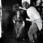 Kiri Pritchard-McLean Instagram - I love this BTS shot from my Peacock tour shoot with @_drewforsyth , this is taken in my living room. I love it because I t's reminding me of one of my fav Welsh icons Henry Cyril Paget. I've got a dream to write a drama about "The Dancing Marquess" and his amazing story one day. Fun fact @philjohnperry who built my headpiece and has his exquisite back in this photo is also obsessed with him but we found out after working together so this big Henry energy isn't deliberate! MUA @alexogdenclark 👗 @fumbalinas 🦚 🎫 in bio