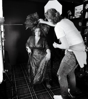 Kiri Pritchard-McLean Instagram - I love this BTS shot from my Peacock tour shoot with @_drewforsyth , this is taken in my living room. 
I love it because I t's reminding me of one of my fav Welsh icons Henry Cyril Paget. I've got a dream to write a drama about "The Dancing Marquess" and his amazing story one day. 
Fun fact @philjohnperry who built my headpiece and has his exquisite back in this photo is also obsessed with him but we found out after working together so this big Henry energy isn't deliberate!
MUA @alexogdenclark 
👗 @fumbalinas 
🦚 🎫 in bio