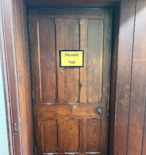 Kiri Pritchard-McLean Instagram - ⚠️ WARNING! SENTIMENTAL POST INCOMING ⚠️ 
This is where the magic happens. Behind this door and in this beautiful old building. 
We've been running comedy classes in Canaolfan Glanhwfa  with @gwneudmakedo for a few weeks and I just have to tell you about it. 
After every session @misskatiegill and I have a fizzy, breathless debrief because the talent we have behind that door in the back room of a Chapel turned community centre is unreal. 

The kids we have coming on Saturdays have soared through our expectations and come to the sessions with big hearts, amazing brains and boundless enthusiasm. I spend every Saturday morning howling with laughter. They're such a clever, offbeat bunch and it warms my heart because they remind me of the funny group of pals I had growing up. 

Tuesday nights are a special affair too. Our senior class is such a sacred place for me. It's so hard to start learning something as an adult. For so many people comedy means public speaking or it's their true love so the stakes are even higher. I said last night that I did a comedy course as an arrogant 22 year old with lots of free time, I did it the easy way. We have a room full of people who're making space for this around kids and careers & I've got so much respect for that. I'm also so excited because I see it all ahead of them. I can see the stand ups, I can see the writers, the directors, the sketch performers. It's so natural to them and they don't even realise it. 

Katie and I set up @gwneudmakedo because we know there's talent in the area and we wanted to give it somewhere to go. In a few short weeks I already feel like this is bigger than us and I know this school is going to be a really important and long lasting part of Wales's cultural landscape. That's not arrogance, it's the people coming, not us. The magic is being made in the back room of a chapel in Llangefni and if that isn't a reflection of culture in Wales I don't know what is.