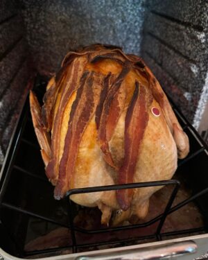 Kirsten Gillibrand Instagram - The turkey is just about done! I cover my turkey in bacon before I cook it - it keeps it super moist and flavorful. Here are my Thanksgiving recipes: 

Thanksgiving Turkey 🦃 

Start with a fresh turkey (if it’s frozen it takes 3 or 4 days to defrost in the refrigerator). Rub the inside cavity with salt. Add 1 apple and 1 onion cut in sections to the cavity for moisture. Put in roasting pan with a cup of water for moisture. Cover entire bird with bacon. Bake at 325 for 20 minutes a pound. Check after 1 hour and remove bacon (so you can eat it!) After the bacon is removed, tent it with aluminum foil so top doesn’t burn. Let rest for 20 minutes when done before you carve it. 

Recipe for Thanksgiving savory stuffing:

Sauté in 2-3 tbs of olive oil (or butter if you prefer):
1 whole large onion sliced 
6 stalks of celery sliced 
2 cups sliced mushrooms 
All to taste:
1 tbs summer savory 
1 tsp sage
1 tsp thyme
1 tsp rosemary
1 tbs parsley flakes
Salt and pepper to taste

Combine sautéed vegetables with 8-12 cups of dried bread cubes (or amount that fits your pan). Add 2-4 cups of turkey broth (if you save giblets from your turkey you can simmer them for an hour and use that broth) until moist but not sticky. Add to a 9x13 greased (butter or olive oil) baking dish and bake for 45 minutes.

Happy Thanksgiving!