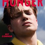 Kit Connor Instagram - You may have recognised him for his role in the Elton John biopic Rocketman, but it was this year’s widely-adored series Heartstopper that propelled @Kit.Connor into the limelight.  Days after the Netflix series dropped, we met with the actor one windy morning in South London. Wandering around a former military airfield, Connor reminisced upon areas that played pivotal roles in his childhood.  “Perfectly on time, he emerges from a grove of trees, clad in Carhartt and towering much taller than I’d anticipated at more than 6ft,” writes @ryancahill7. “He gives me a friendly wave and a reassuring smile before joining me on a walk around his former stomping ground. ‘I’m so sorry I brought you somewhere so windy!’ he says attentively, pushing his messy chestnut curtains out of his eyes. There’s a hint of facial hair growing through and it’s clear that the last of his teenage features are starting to fall away. Manhood is impending.” We’ve hidden 10 exclusive polaroids of Kit Connor in the pages of The Freedom Issue. Pre-order it now via the link in bio to be in with the chance of finding one of them. @kit.connor wears @stefan_cooke Photographer @rankinarchive  Editorial Director @devinderbains Creative Direction and Design @katastrophe.33 Writer @ryancahill7 Stylist @samth0mps0n Beauty Editor @marcoantoniolondon using BOY DE CHANEL and BLEU DE CHANEL 2-in-1 Moisturiser @chanel.beauty Hair Editor @nickirwinhair using @wahlpro Electricals Fashion Assistant @larahargrave Photography Assistants @itsbethanevans, @marcuslister96, @cnawanga at @rankinassistants  Producer @sarah__the__star at @rankincreative Production Designer @iamwapp