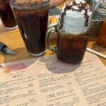 Kristen Ashley Instagram - At my favorite brunch place with my favorite people and starting it off with a Boozy Brew. Life is good in the Rock Chick Lane. #lifeintherockchicklane
