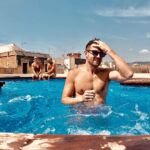 Kyle Dean Massey Instagram - Barcelona rooftop. @axelhotels #HeteroFriendly #axelexperience #axelwallbarcelona Axel TWO Barcelona