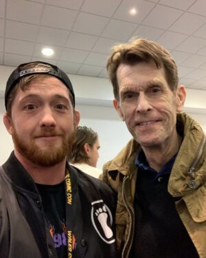 Kyle Greenwood Instagram - Goodbye and RIP to the legendary voice actor Kevin Conroy. It was an honor to meet him this past May and tell him how much Batman: the animated series meant to me as a kid. He couldn’t have been nicer about my fan-boying and after what was a long day of autographs and photos he was glad to take one more pic with a fan. Godspeed sir, you will always be my Batman/Bruce Wayne.