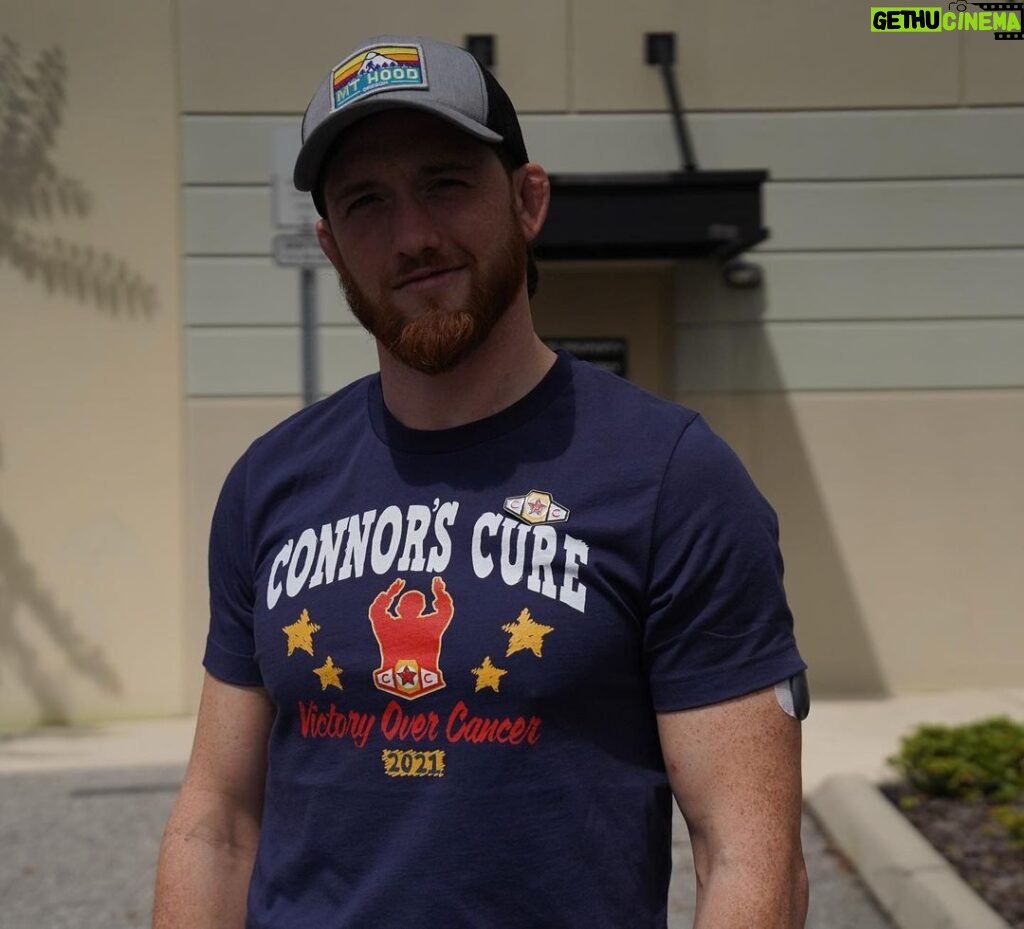 Kyle Greenwood Instagram - I’m PROUD to support @ConnorsCure during #PediatricCancerAwarenessMonth. Join me and fo the “V” for #VictoryOverCancer and tag @TheVFoundation @WWECommunity Shop Here: https://shop.wwe.com/collections/connors-cure