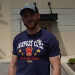 Kyle Greenwood Instagram - I’m PROUD to support @ConnorsCure during #PediatricCancerAwarenessMonth. Join me and fo the “V” for #VictoryOverCancer and tag @TheVFoundation @WWECommunity Shop Here: https://shop.wwe.com/collections/connors-cure