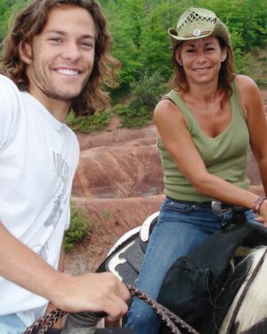 Kyle Schmid Instagram - A few months ago I received a call that my mother had been rushed to the ER. I stuttered in response, “I’ll be on the next flight home”. I had stepped out of a movie to take the call and my hands trembled as I tried to text my wife that we needed to leave. I took a seat on the floor of the lobby of the theatre and tried to steady myself as a numbness swept over me. 

Around christmas of 2022, doctors discovered a brain tumour. In January, they operated and found that it had metastasized from lung cancer. My mother, a life long smoker, bravely took the deep dive into chemo/radiation treatments and continued to fight as best she could. 

By August, she’d completed treatment taking on one hurdle after the next. I would fly home to check in and help out, to tell her I loved her and confidently encourage her that she’d beat the disease. She was always cold despite the temperature and always wore a sweater. It wasn’t until one of my last trips home, I really got to see how skinny she’d become. I remember giving her a big hug. I then went down to my room and I cried. It was the first I recognized my mother’s mortality. You see, my mom was a bad ass barn-bitch, she’s brave and courageous, but that doesn’t help when your treatments make it nearly impossible to eat or drink.

In October she started the next treatment - chemo every three weeks for the next two years. It was a daunting undertaking. She was tired and weak, but every once in a while we’d talk and she’d pipe up with this bit of energy and it make me wonder (if only for a moment) if this had all just been a dream. 

My mom taught me that it was important to have integrity. She taught me that nothing gets done without hard work. She drove me to soccer practices or auditions almost every night of the week and damn, was she was the most incredible cook. We always looked forward to the “clean out the fridge nights” to see what she’d come up with. She encouraged me to become an actor and helped me to be brave in the face of teenage insecurities. She poured herself into our lives as a mother. 

To be surrounded by family was all you ever wanted and on that last day you were. I will forever and always miss you ma. ❤️