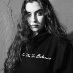 Lauren Jauregui Instagram - Said it w my chest! Merch available now at the link in my stories & bio ✨🤍 Model: my beautiful friend Malik Flournoy-Hooker