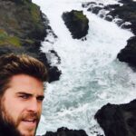 Liam Hemsworth Instagram - #WorldOceansDay I almost died taking this photo on the side of a cliff in hurricane type weather but that's how much I love and care about the ocean. Today is about celebrating one of the most important resources on our planet. We must work together to protect it for future generations. #ItsNotOk #WorldOceansDay #100islandsprotected