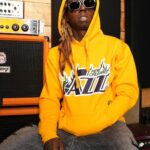 Lil Wayne Instagram - Teamed up with @bleacherreport & @mitchellandness to remix the original New Orleans Jazz jersey. 🤙🏾 Limited edition collection on sale now! Link in bio. Shoutout @pelicansnba