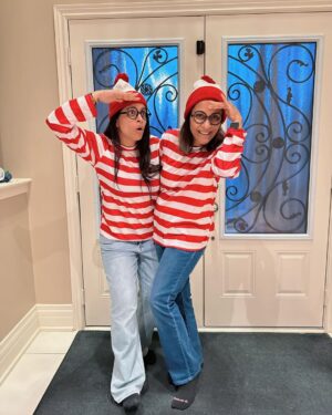 Lilly Singh Instagram - My mom’s favourite activity is playing Where’s Waldo. Naturally I had to get us these matching Halloween costumes. I feel like the older I get, the more I want to give my parents opportunities to act like children and have fun. They spent most of their life being responsible, so today… we eat candy and dance to the Monster Mash 🫡