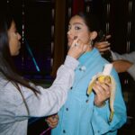 Lilly Singh Instagram - Everyday I eat a banana at 1pm to break my fast. I’m usually working at 1pm so I decided to embrace it and make it art. *cue Hollaback girl* IYKYK 🍌