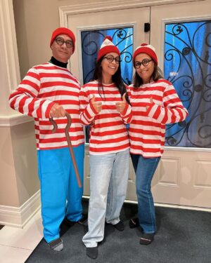 Lilly Singh Instagram - My mom’s favourite activity is playing Where’s Waldo. Naturally I had to get us these matching Halloween costumes. I feel like the older I get, the more I want to give my parents opportunities to act like children and have fun. They spent most of their life being responsible, so today… we eat candy and dance to the Monster Mash 🫡