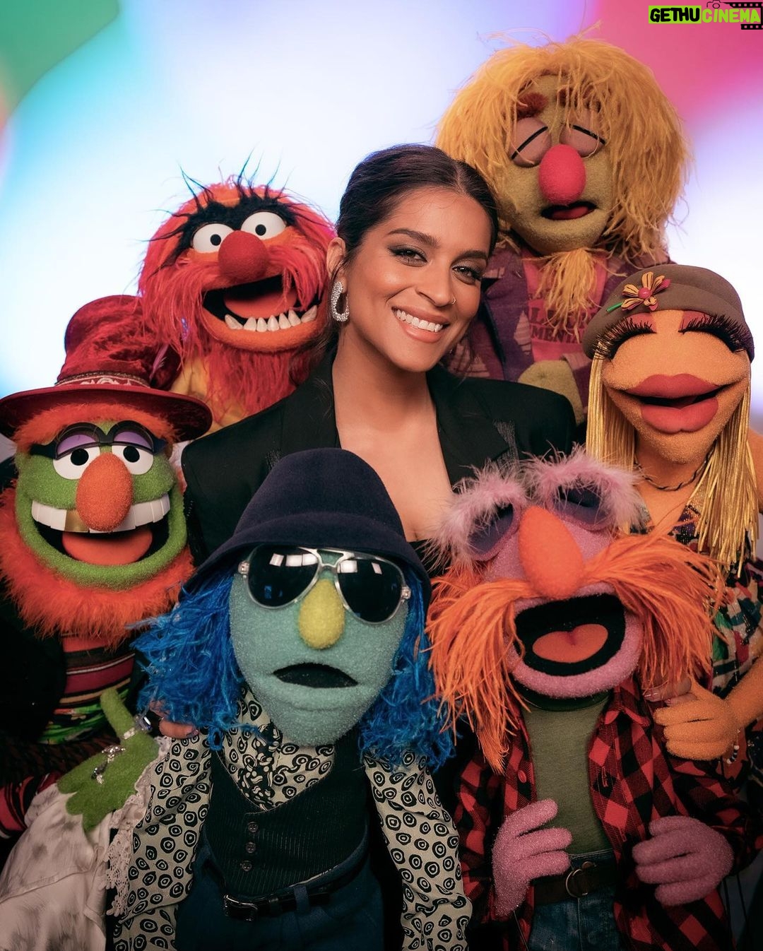 Lilly Singh Instagram - Family portrait ❤️ I. AM. FREAKING. OUT. The Muppets Mayhem starts streaming TOMORROW, May 10th, internationally on Disney+! I can’t wait for you to meet Nora Singh and go on this joyride with us. Set your alarm. Invite your friends over. Tell your Nani to nap accordingly. And let boo know this is the date night plan! I can’t believe we’re just hours away… 🙏🏽 @themuppetsmayhem @electricmayhemband