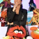 Lilly Singh Instagram - This Desi girl has entered The Muppets franchise!💥 This is the crossover I never knew was possible, but life is about creating the things you wish existed! Our new series @themuppetsmayhem is streaming internationally May 10 only on @disneyplus. Mark your calendars! 🗓️ I have the pleasure of playing Nora Singh, a music exec that is trying to help @electricmayhemband record their first album. And it turns into a WILD ride. I can’t wait for you to see it! So strap in! It’s about to be MAYHEM! 🎸 🥁 BRUAHHHHH!! #TheMuppetsMayhem #DesiGirl More to come. Keep watching this space 😉