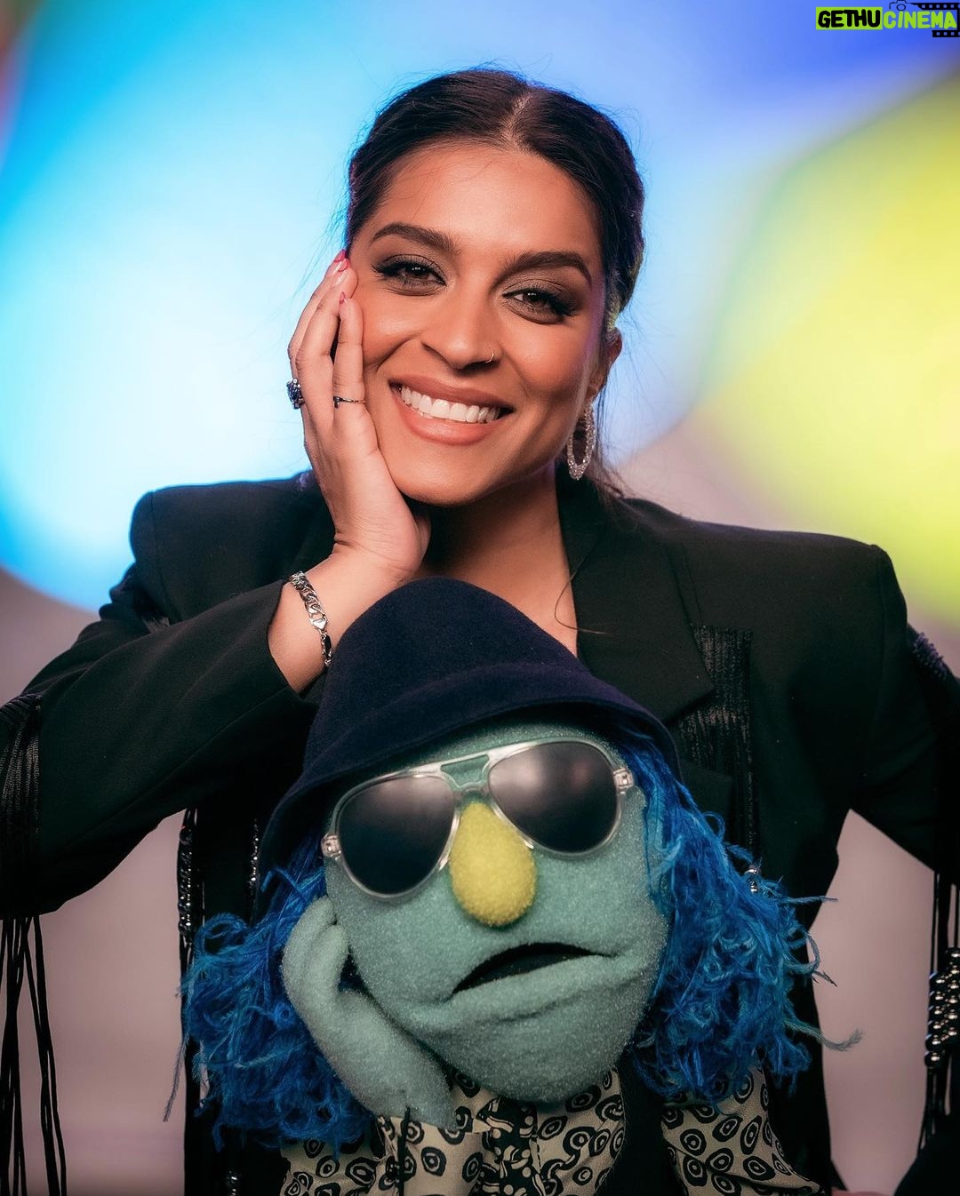 Lilly Singh Instagram - Family portrait ❤️ I. AM. FREAKING. OUT. The Muppets Mayhem starts streaming TOMORROW, May 10th, internationally on Disney+! I can’t wait for you to meet Nora Singh and go on this joyride with us. Set your alarm. Invite your friends over. Tell your Nani to nap accordingly. And let boo know this is the date night plan! I can’t believe we’re just hours away… 🙏🏽 @themuppetsmayhem @electricmayhemband