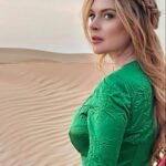 Lindsay Lohan Instagram - 🏜👗🙌                  Dress: @miumiu   Makeup: @hindash   Hair: @hair_by_yazan_  Photography: @slimi7 Al Faqaa Desert