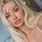 Lindsey Pelas Instagram - rainy days and fluffy blonde hair 🌧️ gifted by @savagestrandss