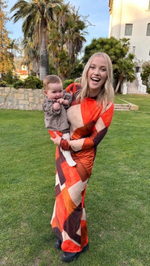 Liz Trinnear Instagram - 6 months in vs. 6 months out.
.
We went to a beautiful wedding in Santa Barbara this weekend. I decided to change my outfit last minute, not realizing that the last time I wore this dress I was in Santa Barbara, pregnant with Nico … 
The first video is from February 2023 and the second is from December 2023. I loved being pregnant with her, dreaming about what she would look like, sound like, smell like. Now that she’s here she’s just the most joyful, happy, shining ray of sunshine, brightening up every room she walks into ☀️Moments like this remind me of how far we’ve come in our journey to have her. This is your reminder to not give up on whatever that dream may be. It will be worth the wait 🌈