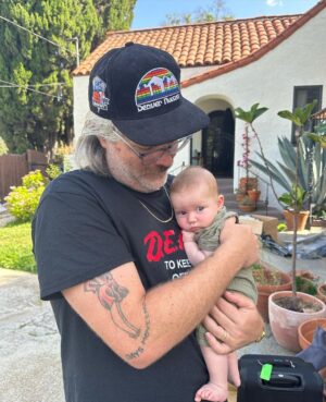 Liz Trinnear Instagram - Nico’s first plane ride & trip to California ☀️💕🥹
.
1. Pre plane ride pep talk
2. Snackin’ on the plane with dad
3. Uncle David came to pick us up!
4. Cuddles with Uncle Davie
5. One for caffeine, one for “we did it!” 
6. Uncle Sean!
7 & 8. Daddy time 💕
9. Hanging with bestie Auggie