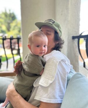 Liz Trinnear Instagram - Nico’s first plane ride & trip to California ☀️💕🥹
.
1. Pre plane ride pep talk
2. Snackin’ on the plane with dad
3. Uncle David came to pick us up!
4. Cuddles with Uncle Davie
5. One for caffeine, one for “we did it!” 
6. Uncle Sean!
7 & 8. Daddy time 💕
9. Hanging with bestie Auggie
