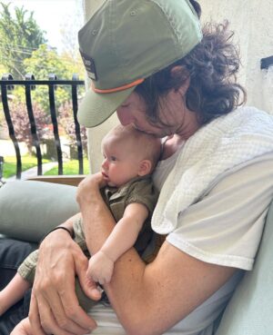 Liz Trinnear Instagram - Nico’s first plane ride & trip to California ☀️💕🥹
.
1. Pre plane ride pep talk
2. Snackin’ on the plane with dad
3. Uncle David came to pick us up!
4. Cuddles with Uncle Davie
5. One for caffeine, one for “we did it!” 
6. Uncle Sean!
7 & 8. Daddy time 💕
9. Hanging with bestie Auggie