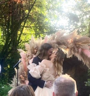 Liz Trinnear Instagram - Two of my favorites got married last weekend and it took me over a week to recover from smiling so hard (and to make this post) 😭😂💕
Their wedding was so full of love, happiness and magic, it was like a real life fairytale ✨
@lauramosescollins looked like a princess and @matthewstylist is her prince. 
I’ve known Matt for 12 years now and I’ve NEVER seen him so darn happy (and that’s saying a lot because he’s the happiest, most positive guy I know). Standing by his side as a groomswoman was an honor 💕 Laura is the kind of person you hope your best friend marries and I like to think that Matt is not the only lucky one here, we all gained Laura as a friend and I’m forever grateful. WHAT A BLAST! 💕💕💕
(Also - @nathanielmotte said I was serving up some Neo from the matrix vibes in my custom @alfredsung suit dress 😂 - hence photo number 3) 
Also also - shoutout to @reformation for making us gals look extra special for rehearsals 💕