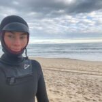 Lucy Fry Instagram - 🌊 Some quiet days in the ocean, feeling like a seal in my ridiculously warm wetsuit.. cosy in the stillness.