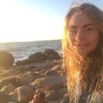 Lucy Fry Instagram - Cheers from a chilly sunset dip 🎉 🌊