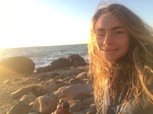 Lucy Fry Instagram - Cheers from a chilly sunset dip 🎉 🌊