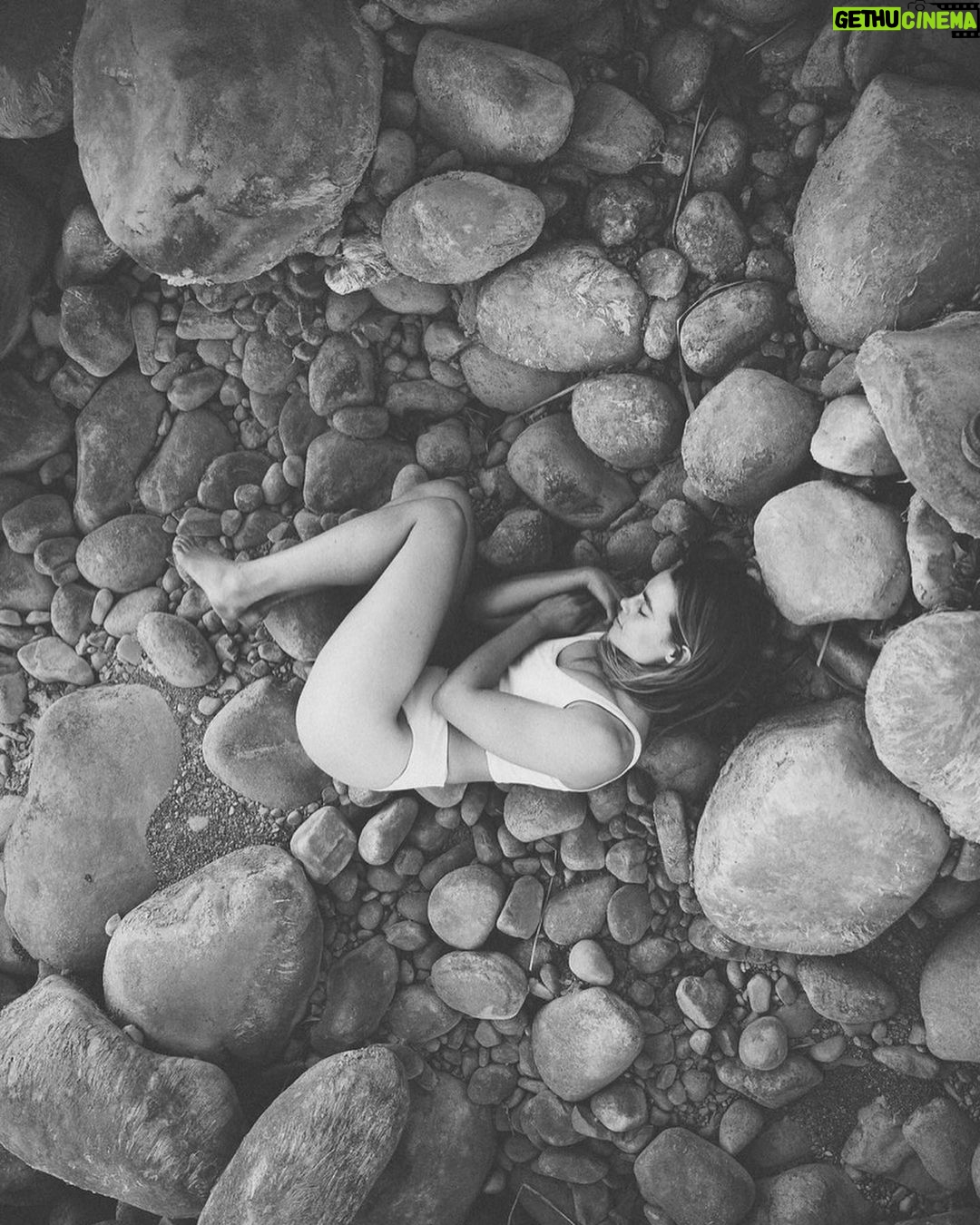 Lucy Fry Instagram - A boulder rolls uphill Exhaustion as the nerves Grind against gravity Rounded shards of sand A worn sea shell She curls into the moon Earth
