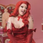 Lucy Loone Instagram - i feel so right in red 🫦😂💋 stills from the king of hearts scene in the “eat it up” music video directed by me shot by @jasonbanker , costume by @eddysonline , hair by @neciashairstyling layed down by @ravenvalentinee ♥️ set design by @alfredospookyart , 💅 & 💄 by me 🔗 IN MY B1O , go do ur daily watch n share the song n vidd with ur friends 🎀🎀🎀💋