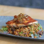 Ludacris Instagram - @ludacrischickenandbeer Atlantic Salmon Fillet with our signature dirty rice and tomato chutney, available both in LA and ATL 🍗 & 🍺 🔥