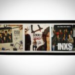 Luke Arnold Instagram – Back in Melbourne and one of the coolest gifts I’ve ever been given is hanging on the wall of the family home.
The remade album covers from Never Tear Us Apart signed by the actual members of @officialinxs 
It was the greatest honour to tell this story alongside such legends.

Still blows my mind