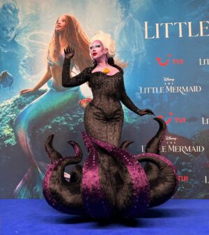 Ma'Ma Queen Instagram - My dear sweet child, that’s what I do, that’s what I live for! 

So proud of this custome couture Ursula I designed and created for @vanessavancartier for the premiere of The Little Mermaid from @disney @disneynl and @disneybe 

This was the most complicated design I have ever created. This garment consist out of many intricate pattern pieces and a lot of invisible elements to make the design come to life. The structure consists or multiple layers to make the fabric stay in its organic shape. 
I have created this dress with all the talent I possess, all the craftsmanship I have trained for over the past years and all the love I have for my dear friend @vanessavancartier 
@xochelseaboy you did an amazing job with the make up making the Ursula character come to life!  We created magic together! 
💜💜💜💜💜💜

To complete this amazing collaboration
💜💜💜Wig by @wigmayson 💜💜💜
💜💜💜Gloves by @dglamour 💜💜💜