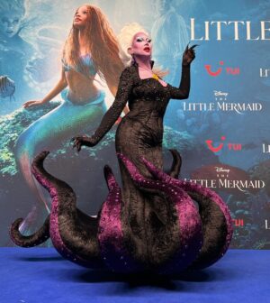 Ma'Ma Queen Instagram - My dear sweet child, that’s what I do, that’s what I live for! 

So proud of this custome couture Ursula I designed and created for @vanessavancartier for the premiere of The Little Mermaid from @disney @disneynl and @disneybe 

This was the most complicated design I have ever created. This garment consist out of many intricate pattern pieces and a lot of invisible elements to make the design come to life. The structure consists or multiple layers to make the fabric stay in its organic shape. 
I have created this dress with all the talent I possess, all the craftsmanship I have trained for over the past years and all the love I have for my dear friend @vanessavancartier 
@xochelseaboy you did an amazing job with the make up making the Ursula character come to life!  We created magic together! 
💜💜💜💜💜💜

To complete this amazing collaboration
💜💜💜Wig by @wigmayson 💜💜💜
💜💜💜Gloves by @dglamour 💜💜💜