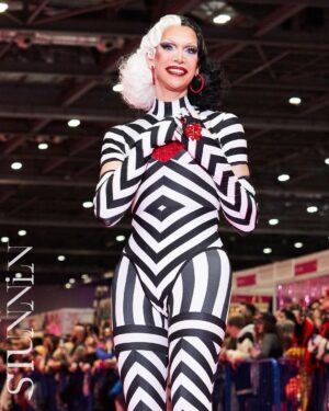 Ma'Ma Queen Instagram - Spreading love on the pink carpet @rupaulsdragcon London 2024! Thank you so much for the beautiful pictures @cyrieljacobs @stunnin.mag 

Thank you @licka_lolly for this Cruella d’Evil inspired hair! 
Outfit made by me ♥️
Special thanks to @xtraxceptit and @_macelton_ for being there every step of the way! For all your help, your amazing energy, you love and unconditional support. 
And ofcourse my love  @megan_schoonbrood , bless us for being besties celebrating this beautiful second drag con together. 💖