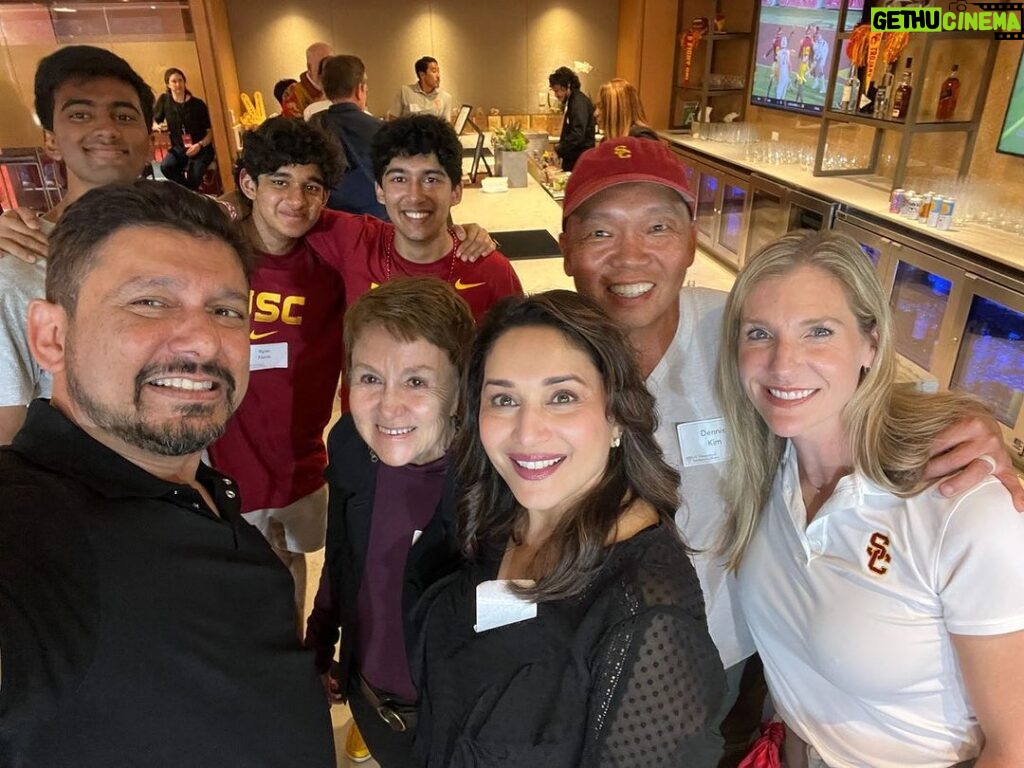 Madhuri Dixit Instagram - Amazing to watch the USC vs Stanford football game as guests of President Folt. The game was action packed and of course USC won 56-10. Fabulous night with amazing people! Many thanks to @President Folt #DeanYannisYortsos #DeanElizabethDaly #DeanEmilyRoxworthy for hosting us. Am grateful to USC for the education the boys will be receiving❤️