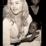 Madonna Instagram - Beautiful Chfifundo James! you’re 18 yrs old today!! Beautiful Mercy James. You’re already a young woman! Beautiful African Queen!! You Surprised all of us! ♥️🇲🇼♥️🇲🇼♥️🇲🇼♥️🇲🇼 You were always the quiet one The gentle one . The Shy and Stoic one. While All of my other children were clamoring for attention, you were Hiding under your hoodie — never wanting to draw attention to yourself. Always Humble and Kind Always the first one to say thank you. To clear the table after dinner! To Come and Hug me and say how much you appreciate something. And Always the most Responsable. Beautiful Mercy James I am really astounded by the woman you have become. Poised and radiant. Skilled and Soulful. A True artist. That hand that was once frozen in your mouth as a child -now makes magic happen when you play the piano. Whether its Erik Satie or Chilly Gonzales. To hear you play Chopin every night in my show with such confidence is such a thrill. To see what you see through The lens of your camera. To watch how you care for your younger sisters. To see you unfold from A Chrysalis to a Butterfly. Beautiful Chifundo James Nothing gives me greater pleasure than to watch you grow. You really are A wonder. Wishing You the happiest of Birthdays! The happiest of everything— because you deserve it . Even though we both hate shellfish the world is your Oyster !! She is waiting for you to devour it. To eat it whole!!! To Slay it!! 🌍🌎🌏💙💙💙 Music by Erik Satie: Gnossienne No.1