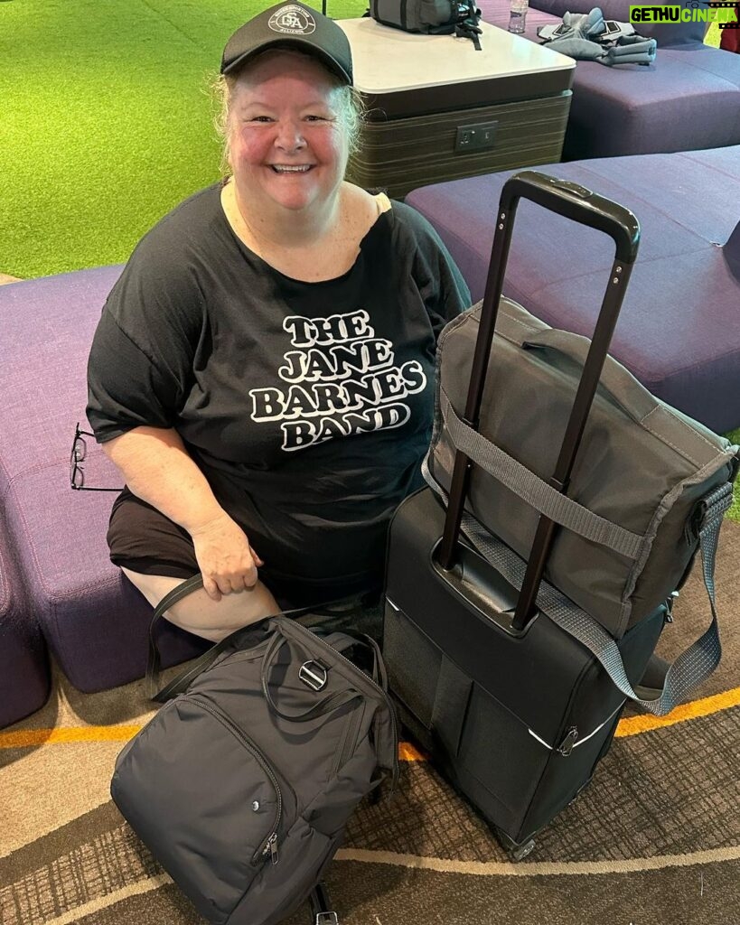 Magda Szubanski Instagram - Hey @jane13barnes !! Been proudly sporting and supporting your band all across US UK and EUROPE!! 😂❤️🙌 As well as flying the flag for Queer Sporting Alliance - their motto? “Can’t run, can’t throw” 😂 Singapore Changi Airport