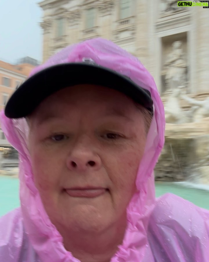 Magda Szubanski Instagram - #MagsTravelTips Compare the pair. I recommend seeing the #trevifountain during a thunderstorm in a flouro pink plastic poncho. You get the joint (almost) to yourself. Most tourists are pussies who don’t like to get wet. That said, it took 3 days for my runners to dry. And I did get a touch of foot rot. The other, sun shiny way is also good. But I couldn’t do the traditional “three coins in a fountain” coz, ya know, inflation #roma #travelblogger #FatLadyTravels ❤️🇮🇹🪙⛲️😘 To those suggesting newspaper in my shoes …all very well…except newspapers don’t exist anymore. And you can’t dry your shoes with digital media. Tho there is a lot of hot air 💨 🔥 Fontana Di Trevi-Roma