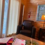 Mandy Teefey Instagram - Favorite writing spot, before Round 2. @writersprogram #writersstudio21! Taking a trip down memory lane! Writing in a cabin